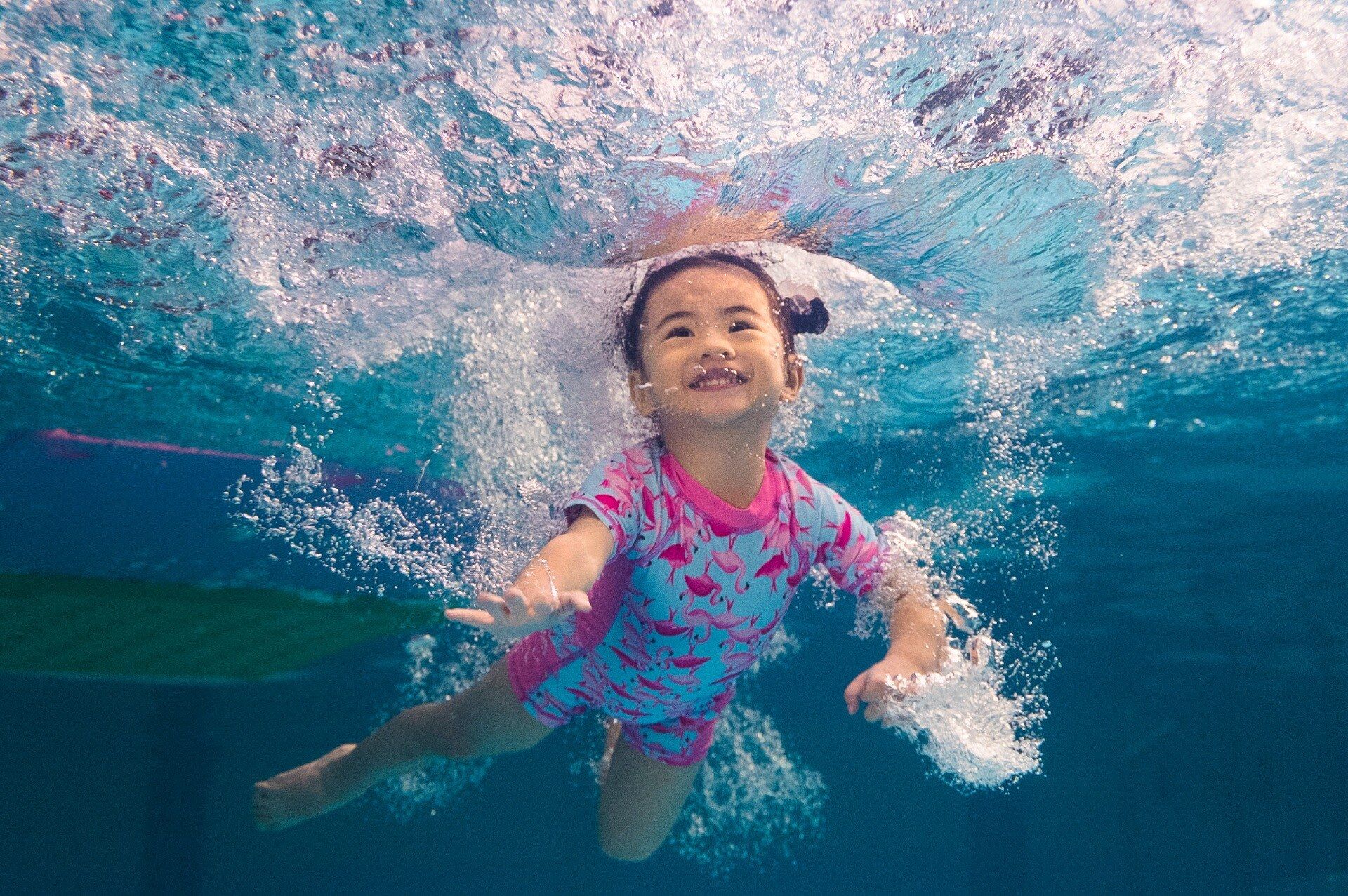 girl swimming underwater